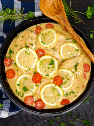 Cast Iron Skillet Creamy Lemon Chicken is the perfect weeknight meal! A simple cream sauce, garlic, fresh rosemary and other herbs for a delicious flavour. 